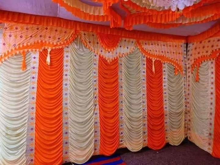 Orange and white tent wall drapes