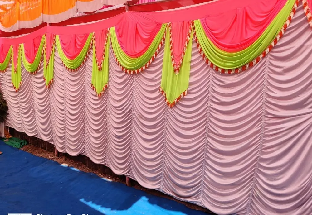 Pink and lime swag over waterfall drape