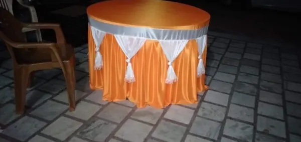 Round table skirting, orange and white